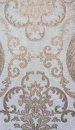 Шпалери вінілові на флізеліні AdaWall Seyyah 1.06х10 завитки вензеля великі структурні золотисті на сіро-беж Київ