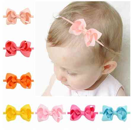 Дитяча повязочка на голову помаранчева - розмір універсальний (на резинці), бантик 8см Київ