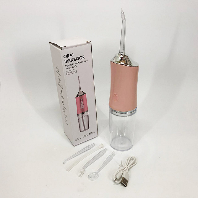Ирригатор для чистки зубов и полости рта Oral Irrigator с аккумулятором и сменными насадками. Цвет: розовый UZ-30 Львов - изображение 10