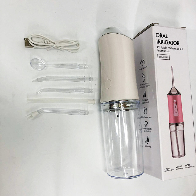 Іригатор для чищення зубів та порожнини рота Oral Irrigator з акумулятором та змінними насадками. BC-907 Колір: білий Київ - фото 7