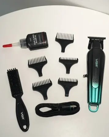 Машинка для стрижки VGR V-935 Black/Green: 7 Вт, 7000 об/хв, 2000 мА·год, 180 хв, LED, 5 насадок, чорно-зелена Одеса