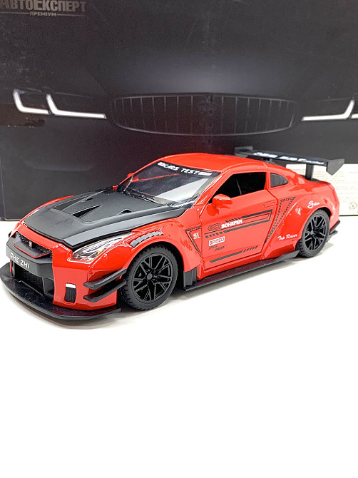 Машинка металева Авто Експерт Nissan Gtr 1:24 світло/звук Червона (GT-1502) Чернигов - изображение 1