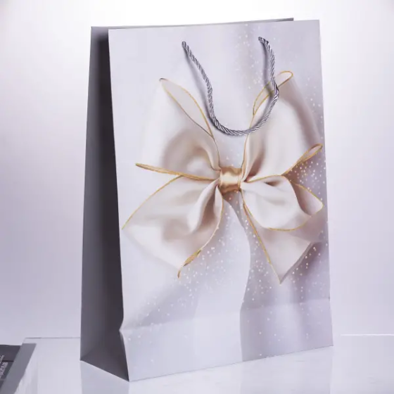 Подарункові пакети з паперу 12 шт з бантом 30×12×42 см Київ