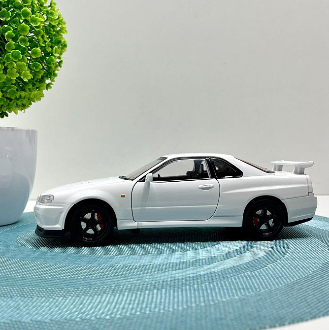 Машинка металева Авто Експерт Nissan GT-R 1:24 світло/звук відчиняються двері капот багажник Біла (1990-21) Чернигов - изображение 2