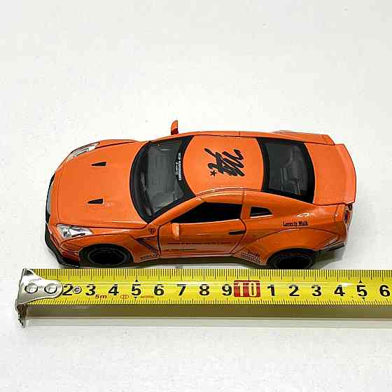 Машинка Auto Expert Nissan GTR металева 1:32 світло/звук/інерційна Жовтогаряча (38071) Чернігів