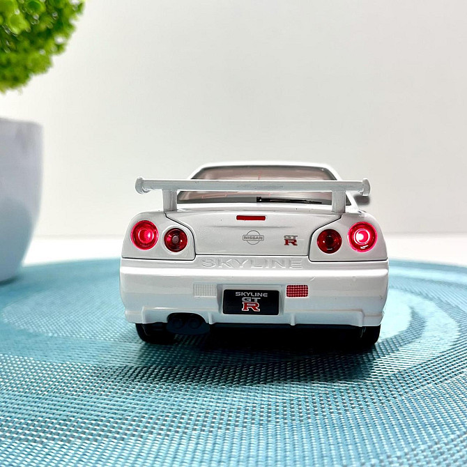 Машинка металева Авто Експерт Nissan GT-R 1:24 світло/звук відчиняються двері капот багажник Біла (1990-21) Чернігів - фото 4