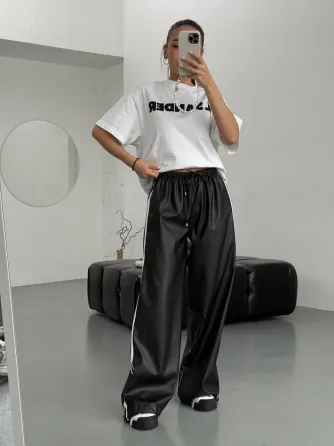 Женские теплые кожаные штаны с лампасами на флисе снизу с затяжками на флисе Харьков