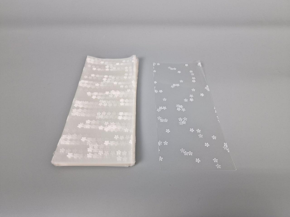 Пакет із малюнком для пакування подарунків (10*25) No09027 (3) "Ромашки" (100 шт.) Харків - фото 1