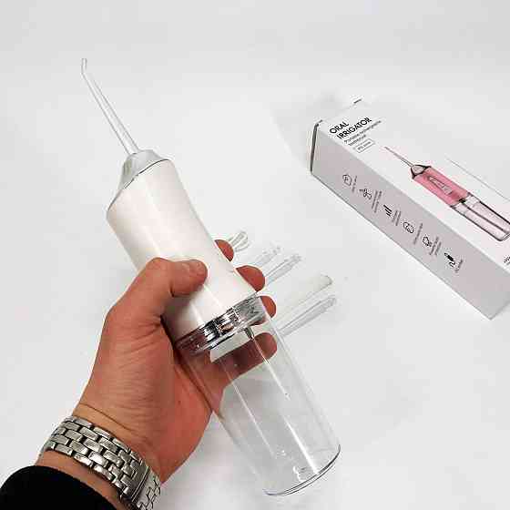 Ирригатор для чистки зубов и полости рта Oral Irrigator с аккумулятором и сменными насадками. Цвет: белый KA-31 Львов