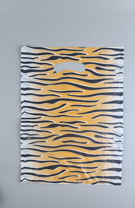 Пакети з вирубаною ручкою (28*40) "ТИГР" Комсерв (100 шт.) Харків - фото 1