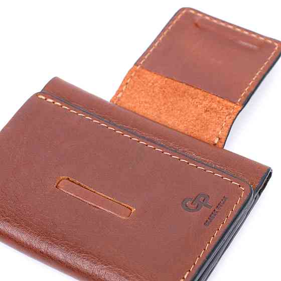 Невеликий гаманець з натуральної шкіри в три додавання GRANDE PELLE 11662 Коричневий Київ