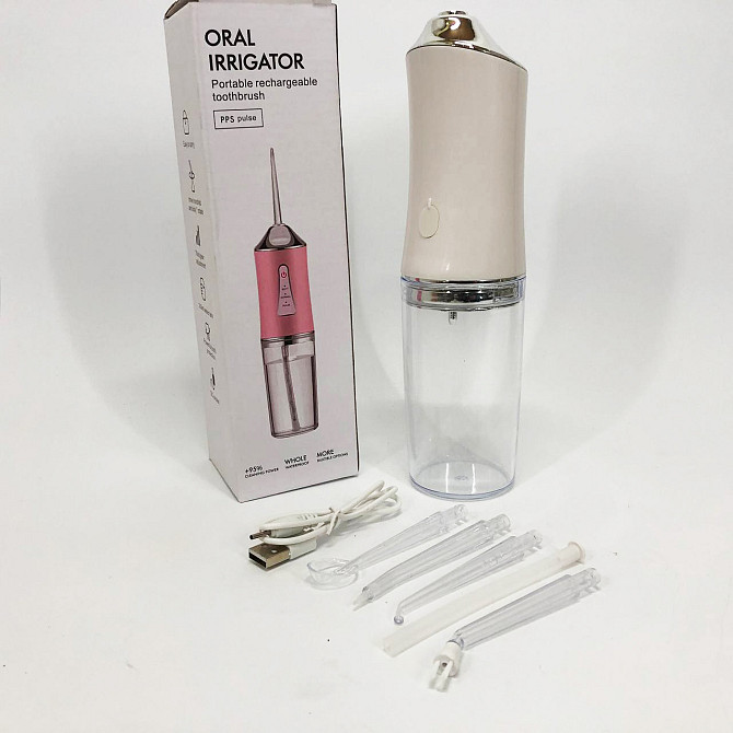 Ирригатор для чистки зубов и полости рта Oral Irrigator с аккумулятором и сменными насадками. Цвет: белый KA-31 Львов - изображение 2