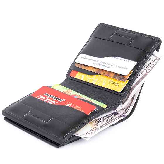 Вертикальное глянцевое портмоне с накладной монетницей GRANDE PELLE 11329 Черное Киев