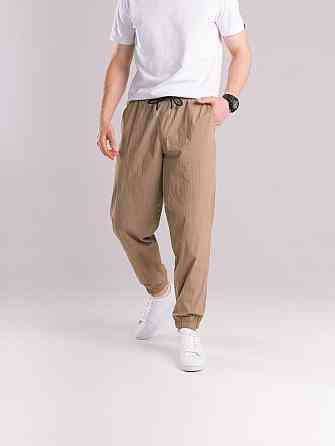 Чоловічі штани джогери з плащівки бежеві з кишенями Pobedov Ground Київ