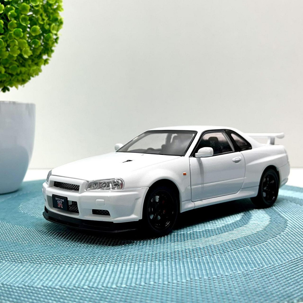 Машинка металева Авто Експерт Nissan GT-R 1:24 світло/звук відчиняються двері капот багажник Біла (1990-21) Чернигов - изображение 1