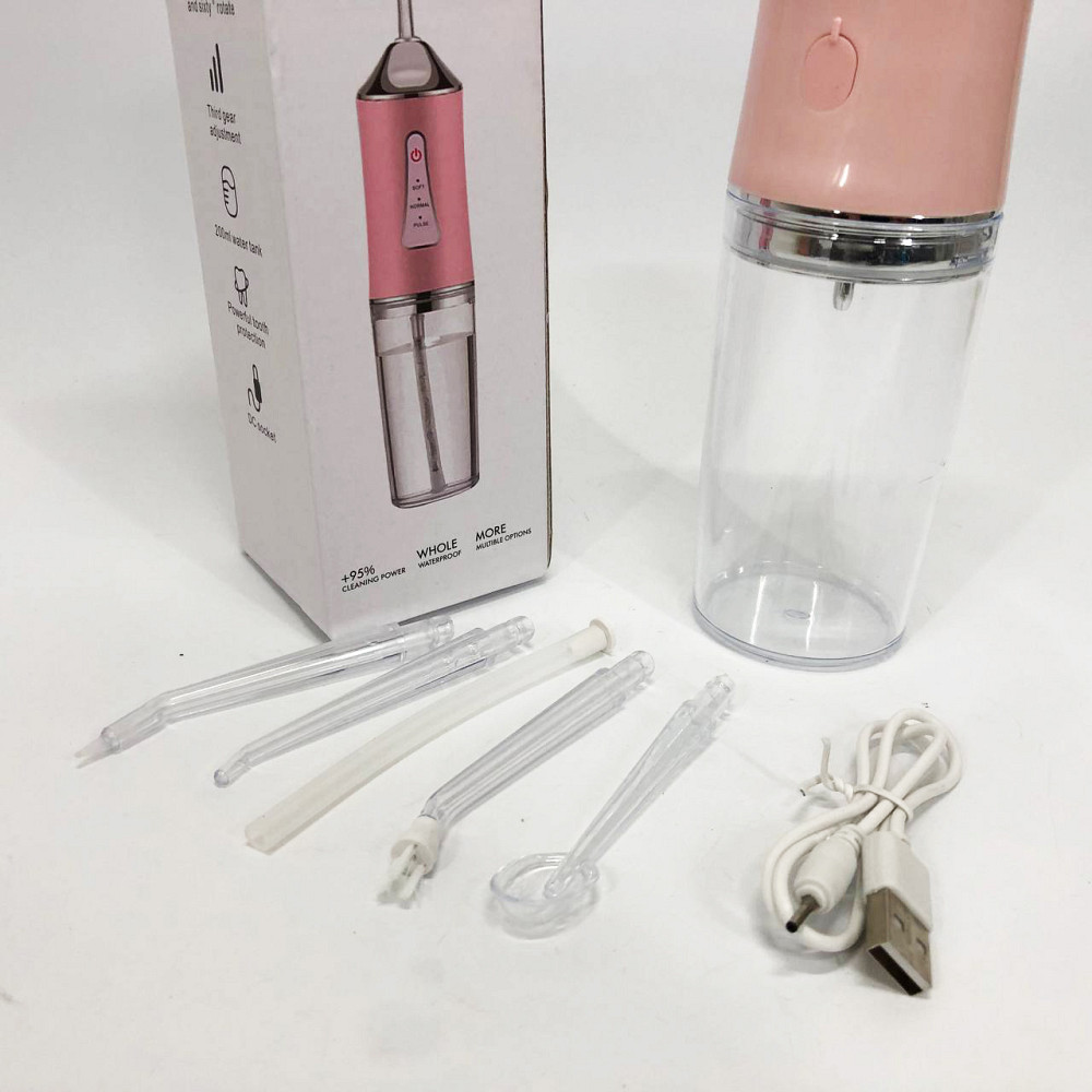 Іригатор для чищення зубів та порожнини рота Oral Irrigator з акумулятором та змінними насадками. Колір: рожевий MK-36 Львів - фото 2
