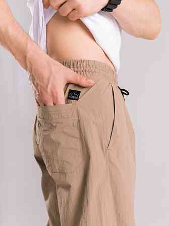 Чоловічі штани джогери з плащівки бежеві з кишенями Pobedov Ground Київ