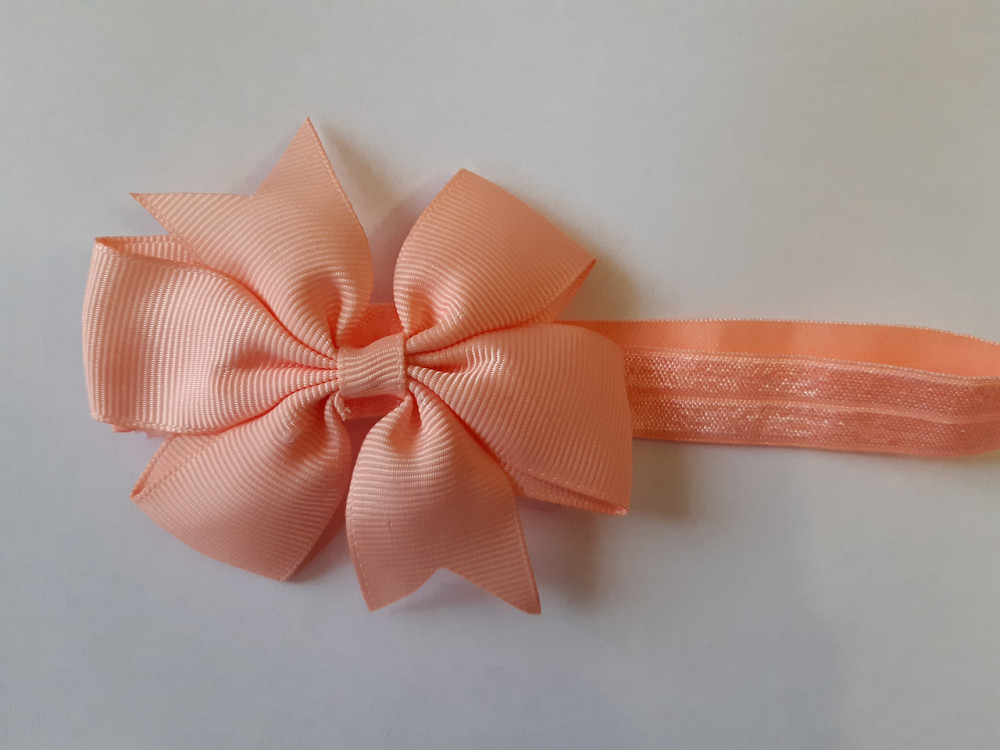 Дитяча персикова пов'язка З дефектом - на резинці, окружність від 30см до 48см, бант 9см Київ - фото 1