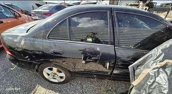 Стекла в двери для Nissan Almera Classic 2006–2012 годов Киев