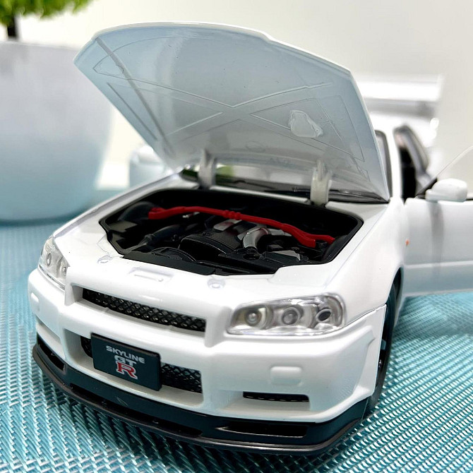 Машинка металева Авто Експерт Nissan GT-R 1:24 світло/звук відчиняються двері капот багажник Біла (1990-21) Чернігів - фото 7