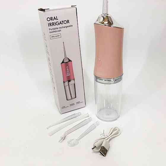Іригатор для чищення зубів та порожнини рота Oral Irrigator з акумулятором та змінними насадками. VC-562 Колір: рожевий Київ
