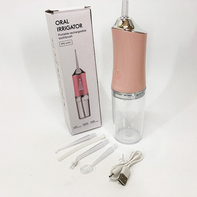 Іригатор для чищення зубів та порожнини рота Oral Irrigator з акумулятором та змінними насадками. VC-562 Колір: рожевий Київ - фото 5