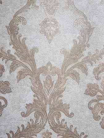 Шпалери вінілові на флізеліні AdaWall Seyyah 1.06х10 вензелю великі структурні золотисті на бежевому Київ