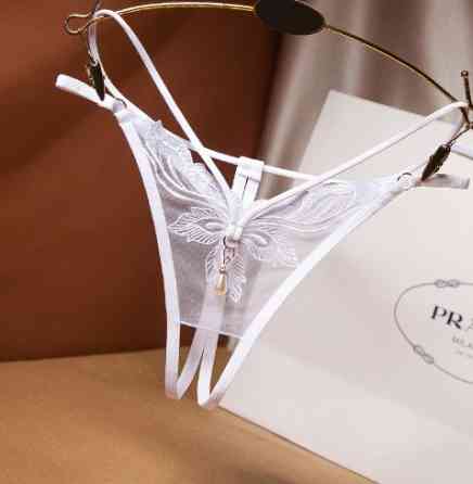 Еротичні трусики з розрізом та бусинкою білі - розмір універсальний (на резинці), в талії до 85см Київ