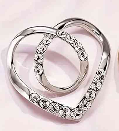 Фіксатор для одягу, шарфів сріблястий Смела