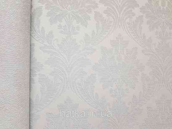 Шпалери вінілові на флізеліні Grandeco Time метрові структурні вензелю завитки сіро-блакитні зі сріблястим Київ