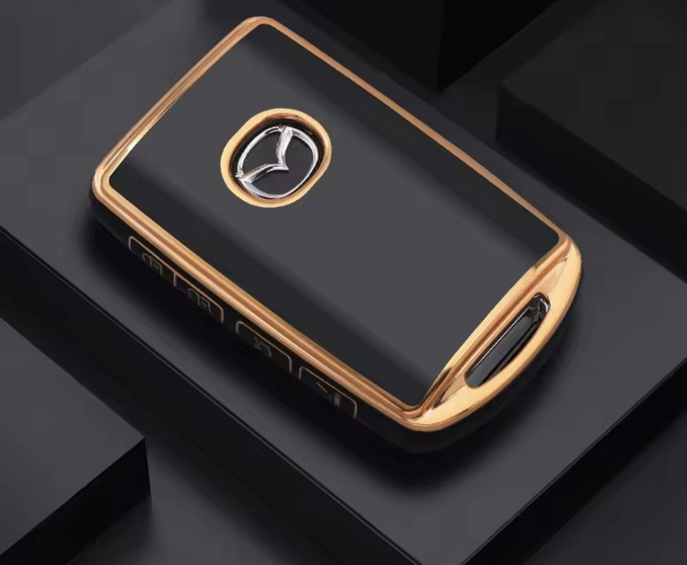 Захисний чохол для автомобільного ключ Mazda на 4 кнопки Чорний із золотистим Сміла - фото 1