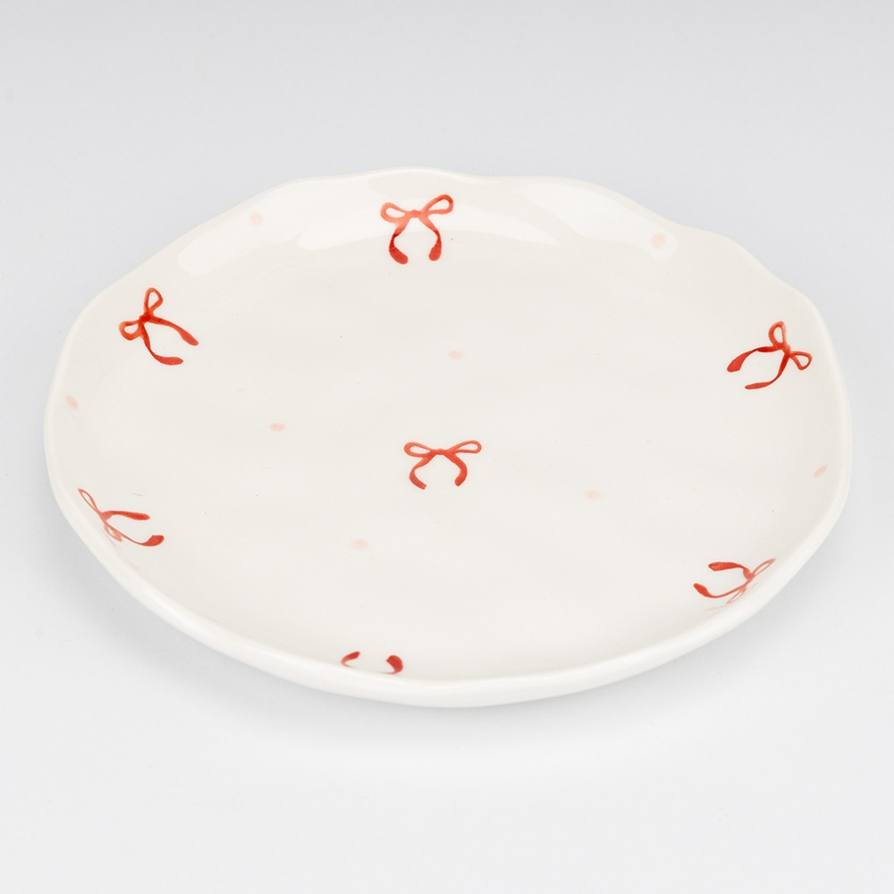 Чашка з блюдцем у святковому дизайні 