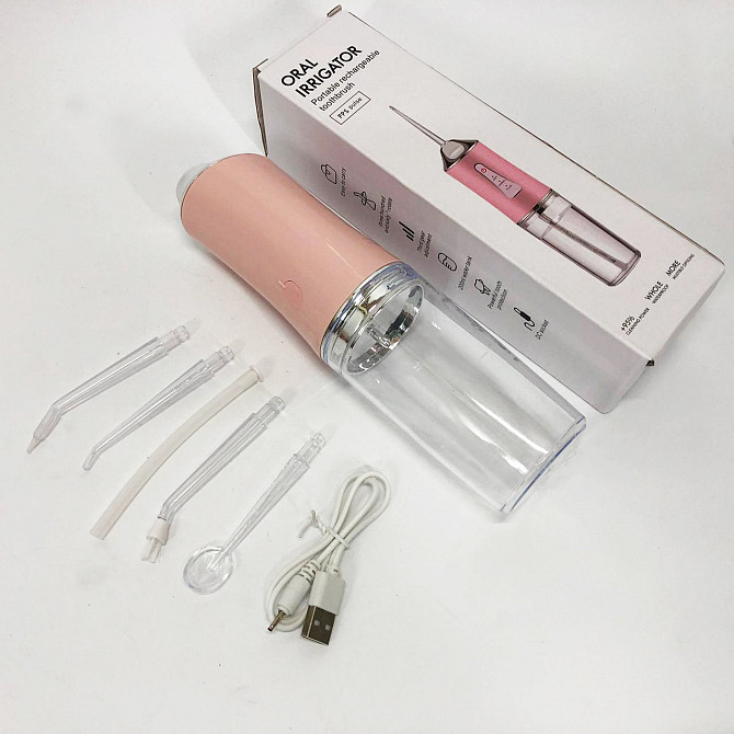 Іригатор для чищення зубів та порожнини рота Oral Irrigator з акумулятором та змінними насадками. VC-562 Колір: рожевий Київ - фото 7