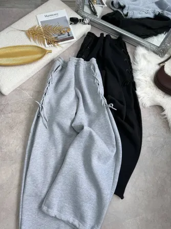 Теплые женские спортивные штаны оверсайз на флисе со шнуровкой по бокам снизу на затяжках Харьков