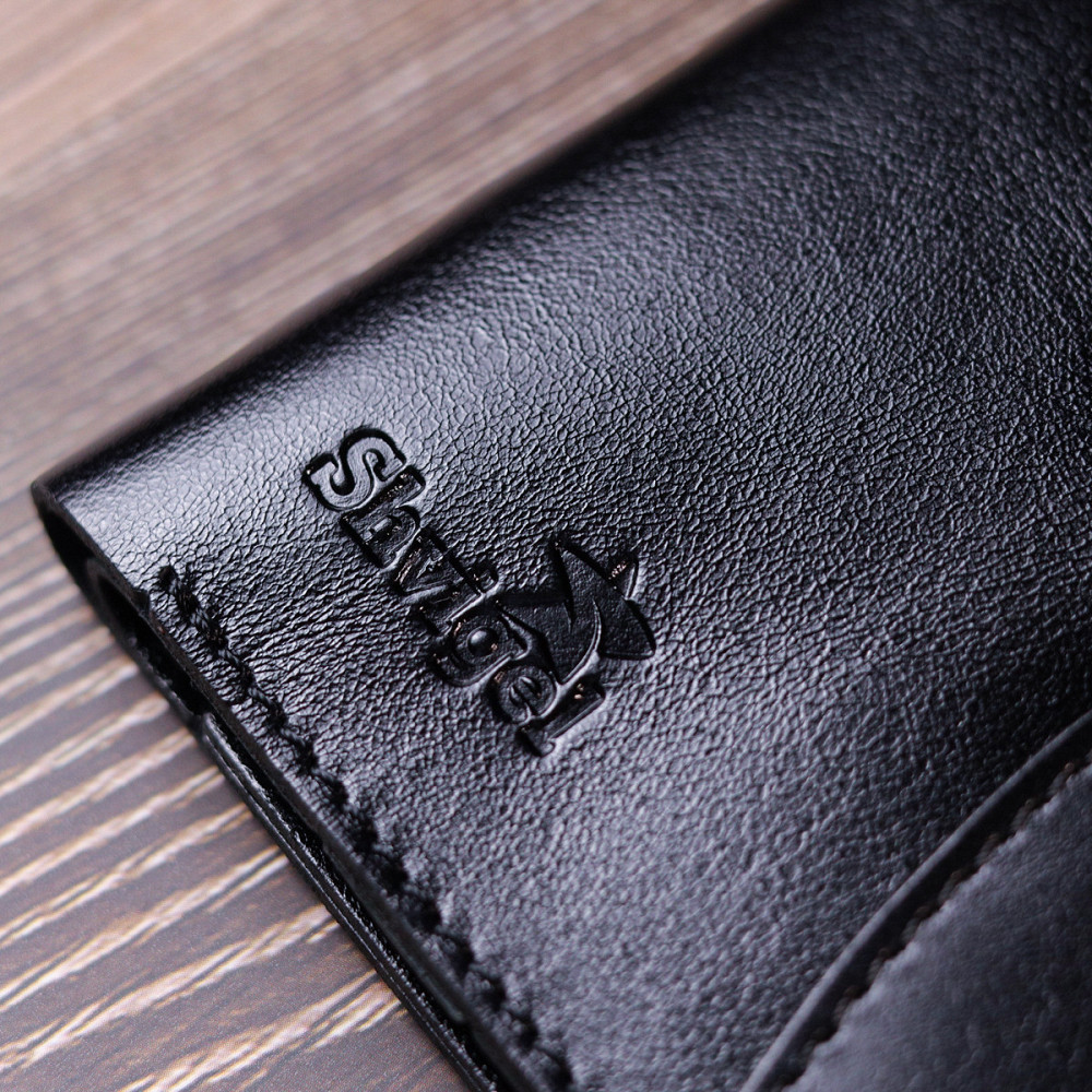 Чоловіче глянсове шкіряне портмоне Shvigel 16617 Чорний Київ - фото 1