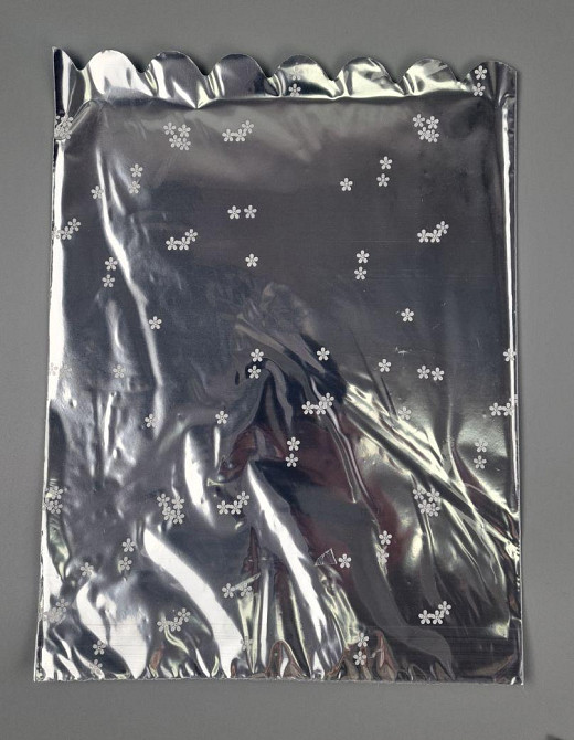 Пакет із малюнком для пакування подарунків (25 * 35) No425 (1) фольгований (ажурний) "Ромашка" (100 шт.) Харків - фото 1