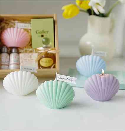 Свеча “Морская ракушка” ручной работы фиолетового цвета Каменец-Подольский