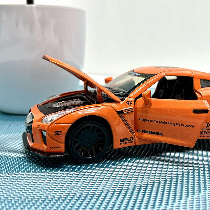 Машинка Auto Expert Nissan GTR металева 1:32 світло/звук/інерційна Жовтогаряча (38071) Чернігів - фото 8