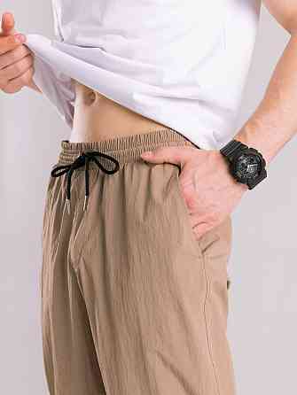 Чоловічі штани джогери з плащівки бежеві з кишенями Pobedov Ground Київ