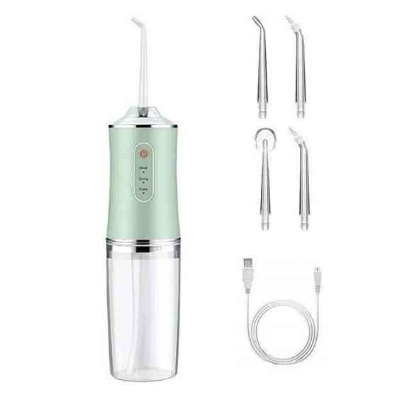 Іригатор для чищення зубів та порожнини рота Oral Irrigator з акумулятором та змінними насадками. YL-394 Колір: зелений Київ