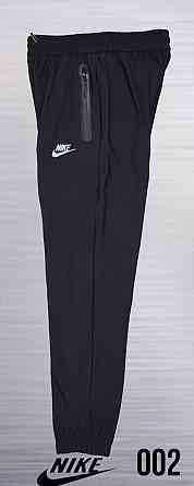 Мужские зауженные штаны под евроманжет Nike ,ткань лакоста new Tech knit Сумы