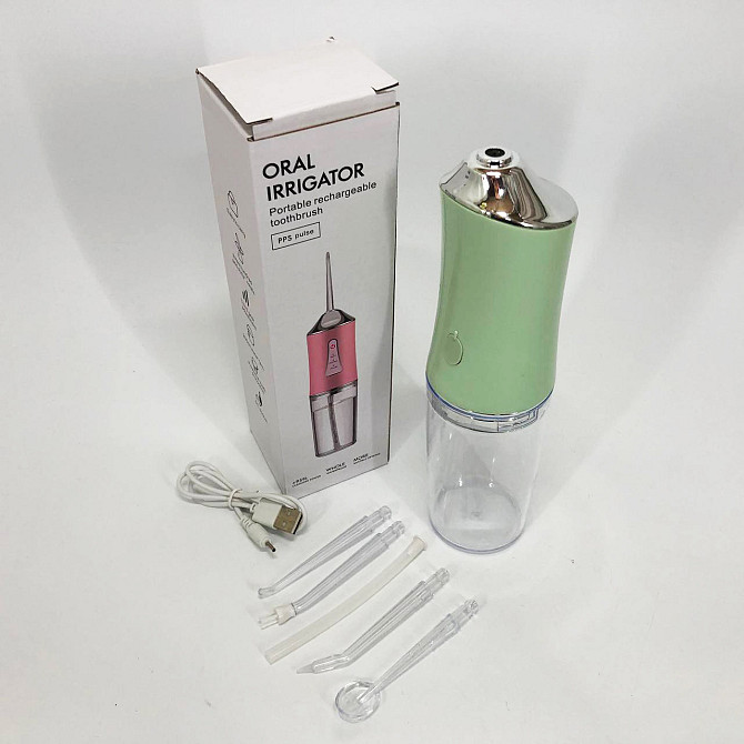 Іригатор для чищення зубів та порожнини рота Oral Irrigator з акумулятором та змінними насадками. YL-394 Колір: зелений Київ - фото 9
