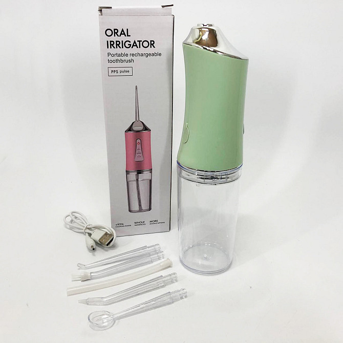 Іригатор для чищення зубів та порожнини рота Oral Irrigator з акумулятором та змінними насадками. YL-394 Колір: зелений Київ - фото 1