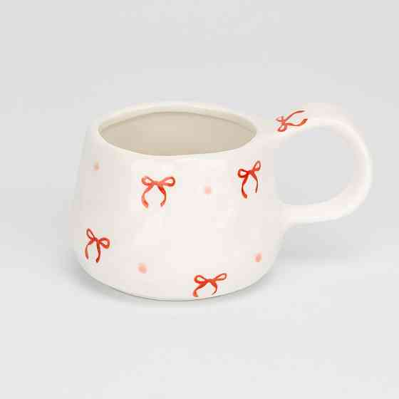 Чашка з блюдцем у святковому дизайні 