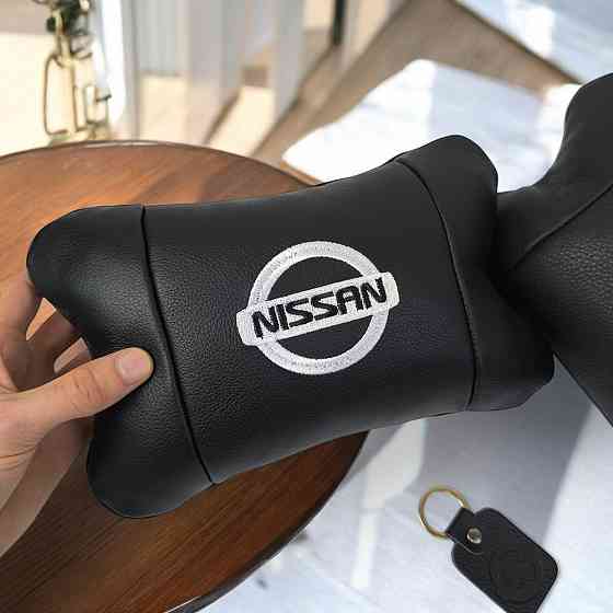 Подушки в авто 2 шт Nissan, натуральна шкіра, з логотипом Ніссан, на підголівник для CN-397 вашої машини Київ
