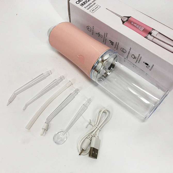 Іригатор для чищення зубів та порожнини рота Oral Irrigator з акумулятором та змінними насадками. VC-562 Колір: рожевий Київ - фото 1