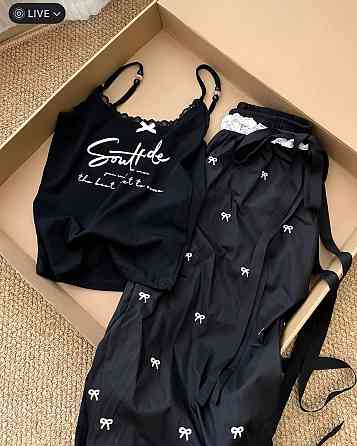 Женские стильные оверсайз брюки карго с бантиками отделаны кружевом плащевка Черный Одесса