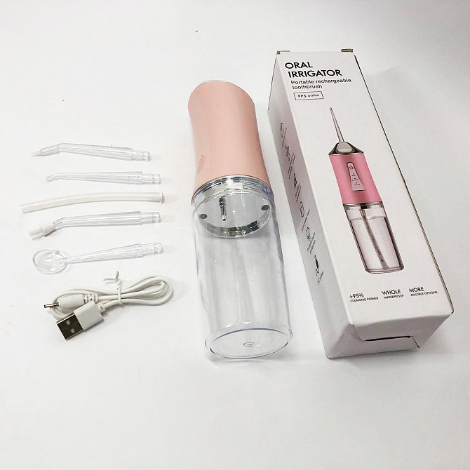 Ирригатор для чистки зубов и полости рта Oral Irrigator с аккумулятором и сменными насадками. Цвет: розовый UZ-30 Львов - изображение 7