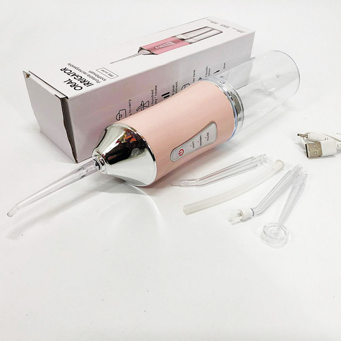 Ирригатор для чистки зубов и полости рта Oral Irrigator с аккумулятором и сменными насадками. Цвет: розовый UZ-30 Львов - изображение 4