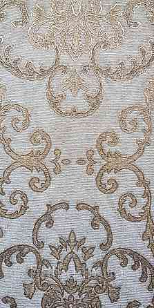 Шпалери вінілові на флізеліні AdaWall Seyyah 1.06х10 завитки вензеля великі структурні золотисті на сіро-беж Київ